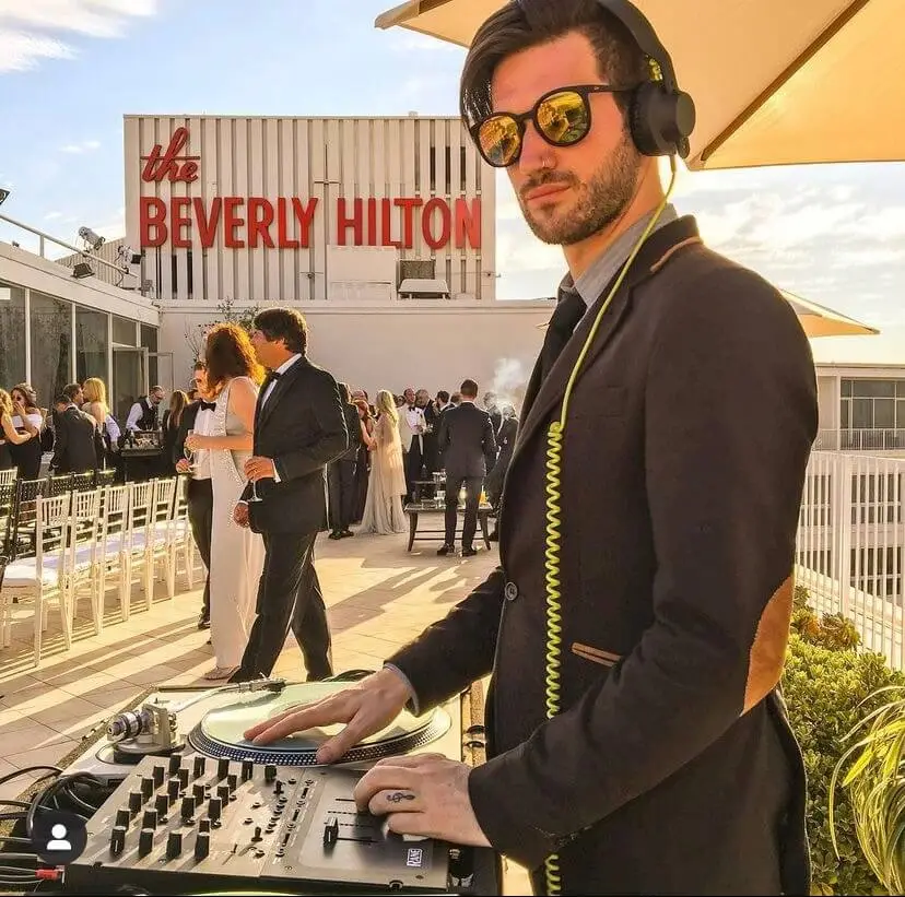 DJ performing at rooftop event, Beverly Hilton.