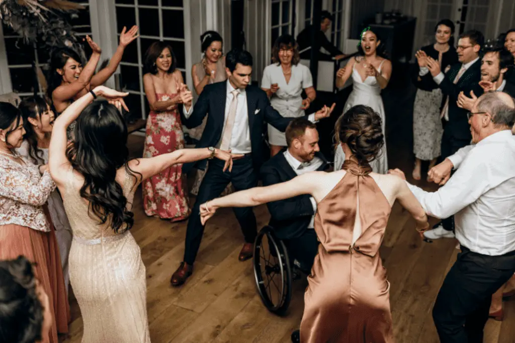 Group dancing at a joyful wedding reception.