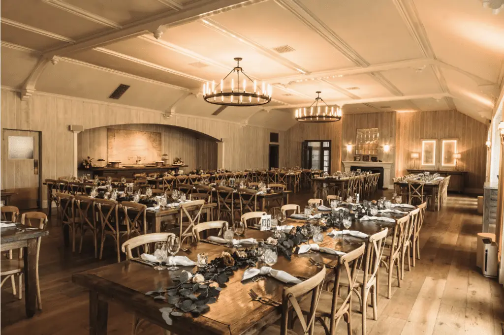Elegant banquet hall with decorated tables and chairs.
